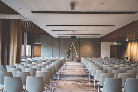 Combined upstairs function room set theatre style with a centre aisle