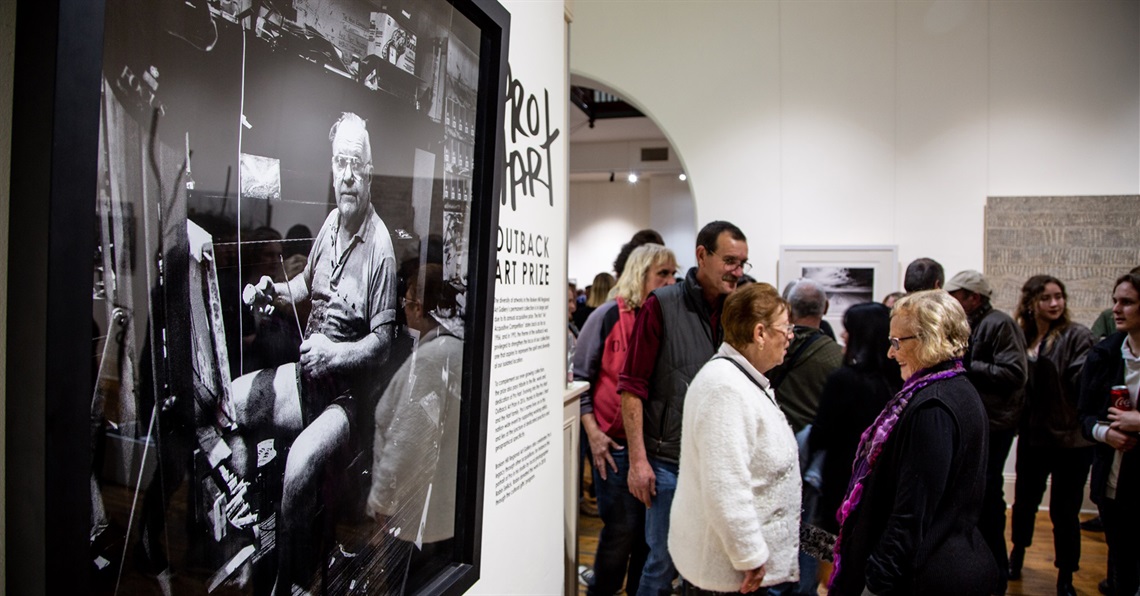 A picture of Pro Hart in his workshop hangs on the Broken Hill Regional Art Gallery wall during the 2018 Pro Hart Outback Art Prize