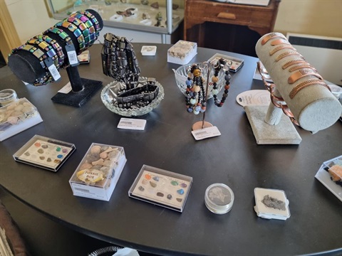 shelf with jewellery, gemstones and fossils