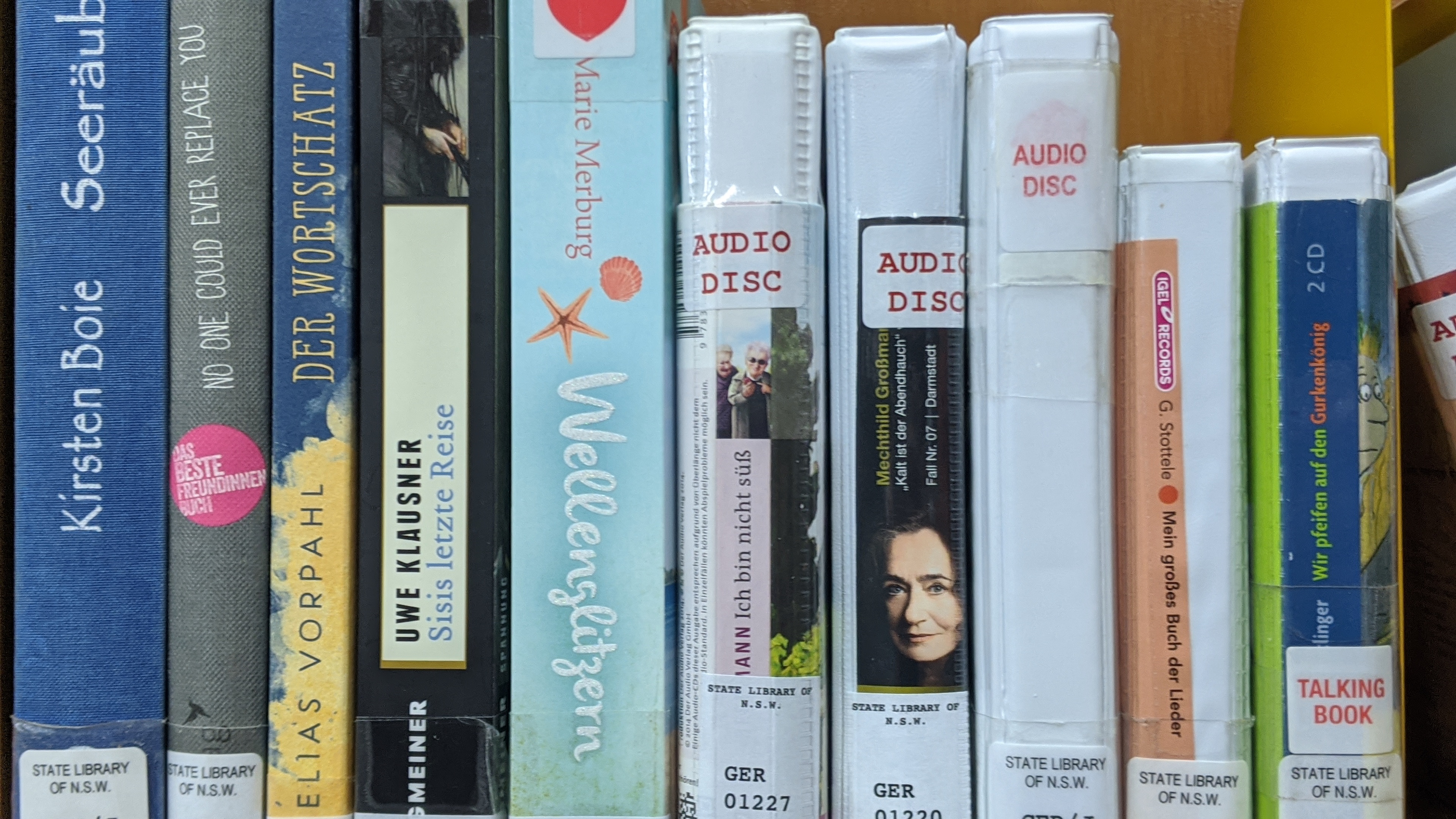 Photograph of the German language books on the shelf, spine view