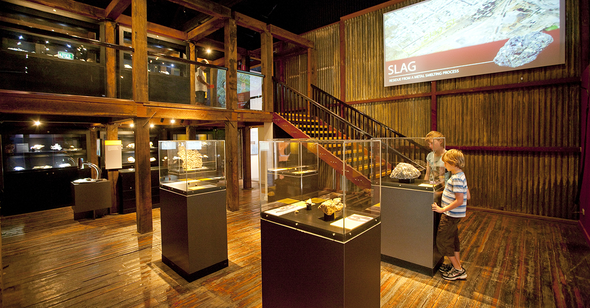 Two children examine a display in the GeoCentre