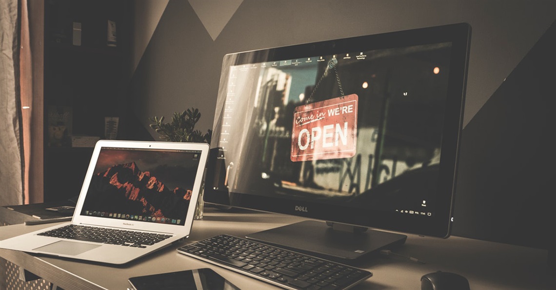 Multiple computer screens on a desk