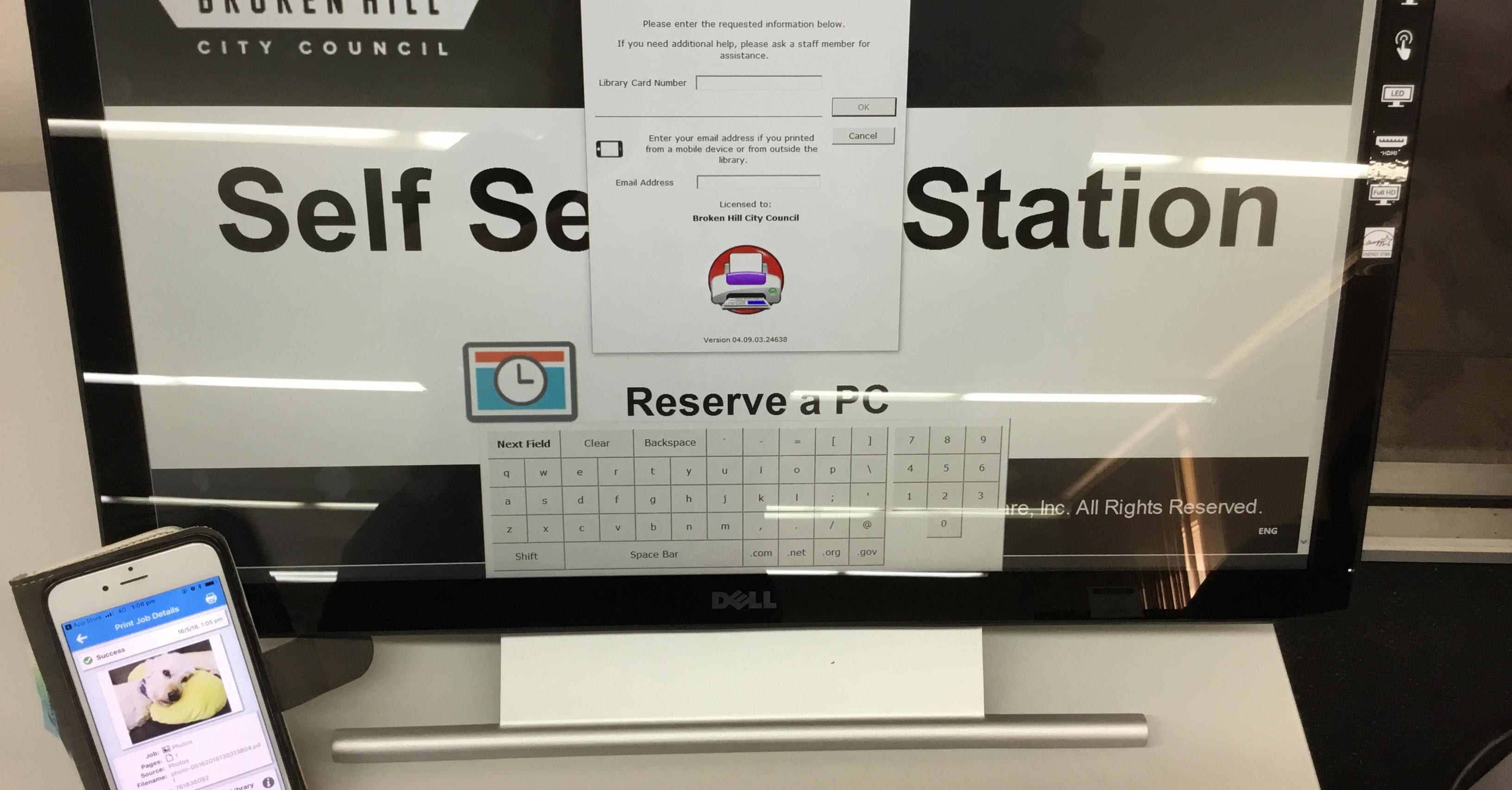 Image of self serve print station and mobile device