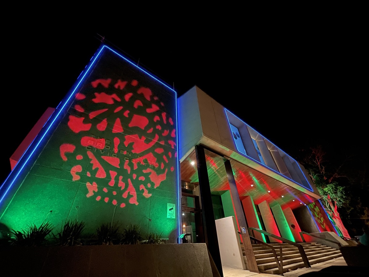image of the civic centre lit up with christmas colours