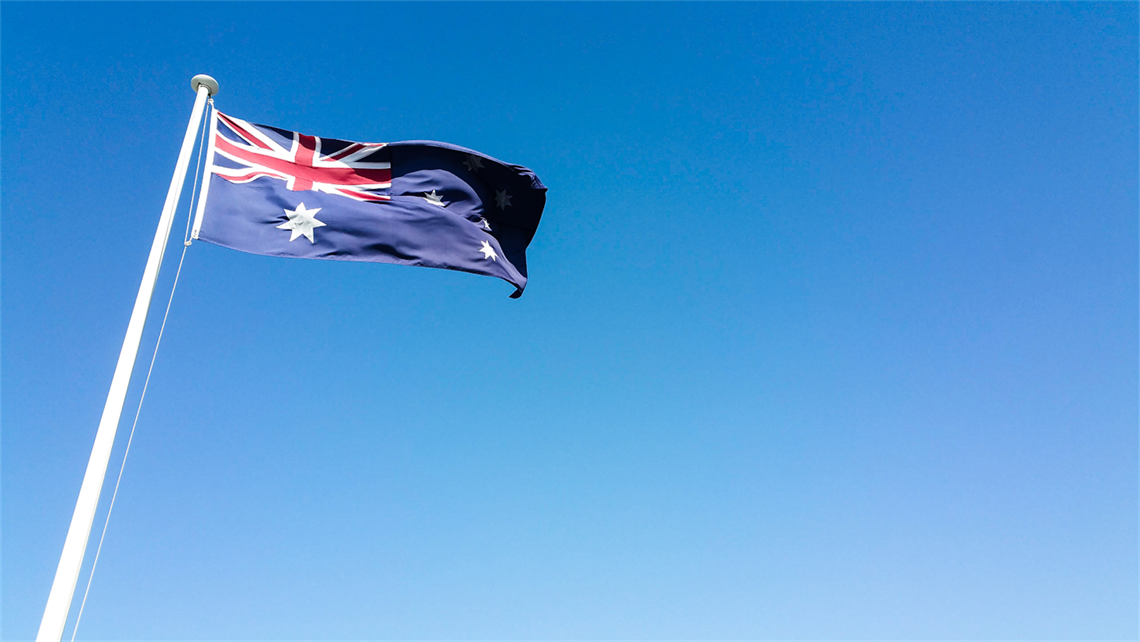 australian flag flying over blue sky