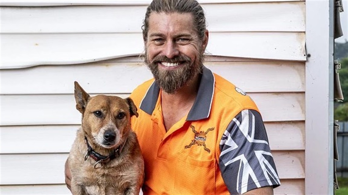 image of farmer dave and a kelpie dog on his lap
