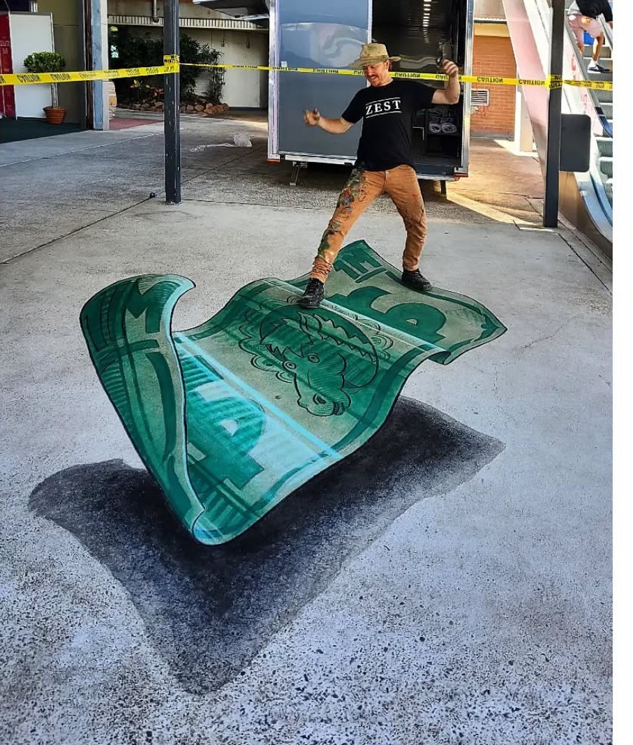 Artist standing on 3D image of a magic carpet flying above the ground