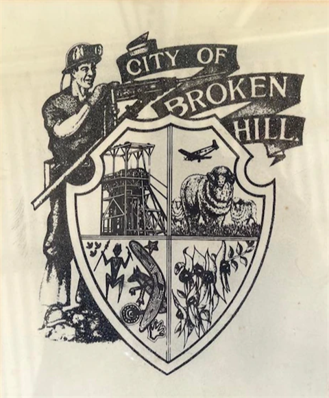 Broken Hill city crest with miner, headframe, indigenous, sturt desert pea and farming depicted