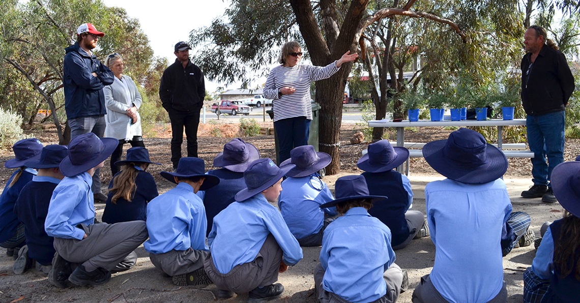 Councillor Marion Browne addresses a group of schoolchildren at the Riddiford Arboretum