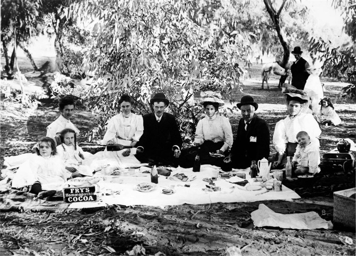 BLACK AND WHITE IMAGE FROM THE JAMES WOOLER COLLECTION SHOWING A GROUP OF BROKEN HILL RESIDENTS HAVING AN OUTDOOR PICNIC. THE PHOTO IS ESTIMATED TO HAVE EBEN TAKEN BETWEEN 1901 AND 1906..jpg